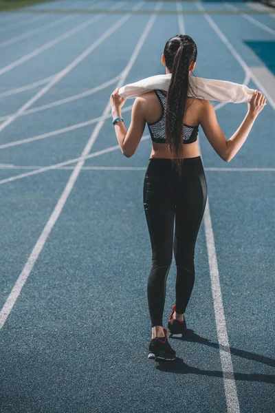 Sportswoman on running track — Stock Photo, Image