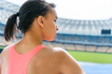 Sportswoman on running tracks  clipart