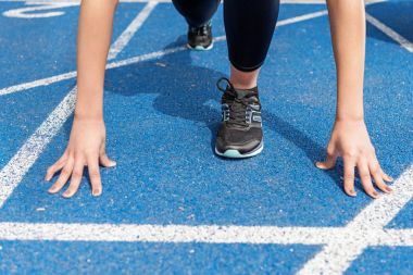 Sportswoman on starting line  clipart