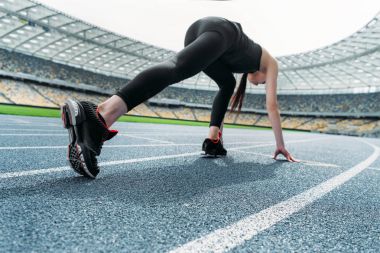 Sportswoman on starting line  clipart