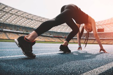 Sportswoman on starting line  clipart