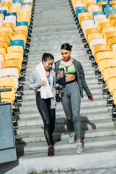 Young sportswomen on stadium — Stock Photo, Image