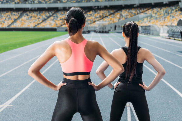 Sportswomen exercising on stadium 