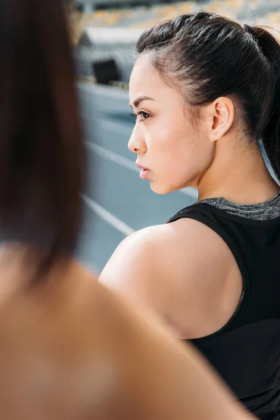 Sportswoman on running tracks — Stock Photo, Image