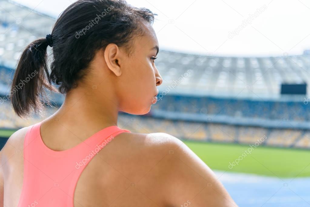Sportswoman on running tracks 