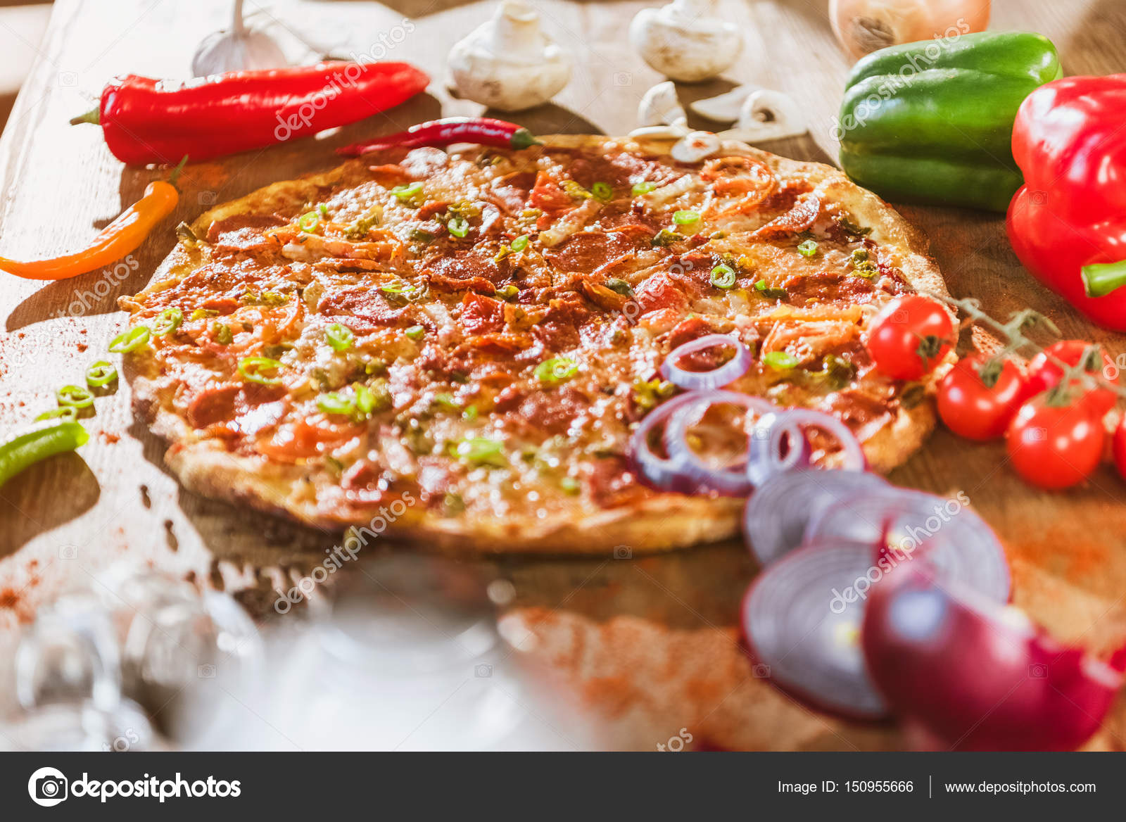 Italian pizza with pepperoni — Stock Photo © ArturVerkhovetskiy #150955666
