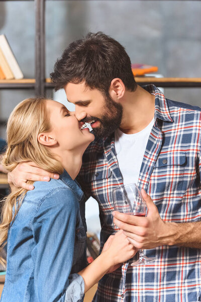 Young loving couple embrace and kissing