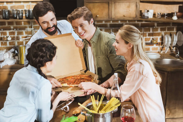 young people eating pizza