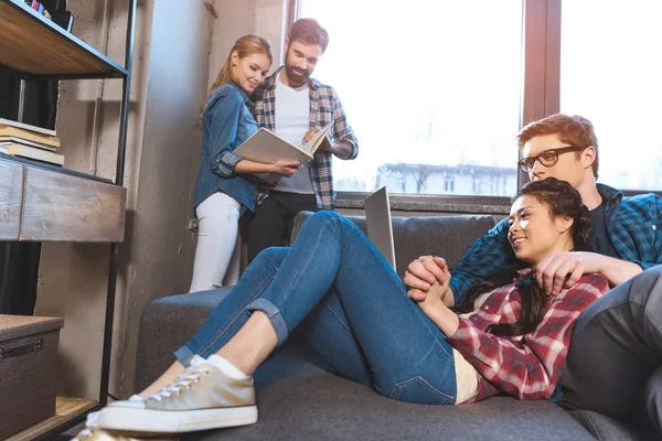 Two loving couples resting in room — Stock Photo, Image