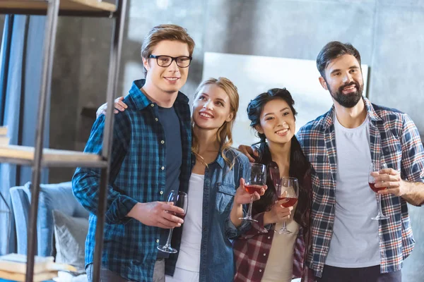 Young friends drinking wine — Stock Photo, Image