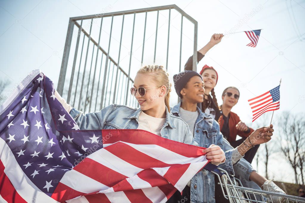 Teenagers with american flags 