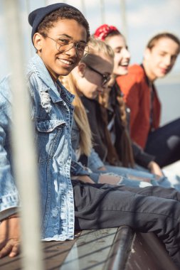 teenagers spending time at skateboard park clipart