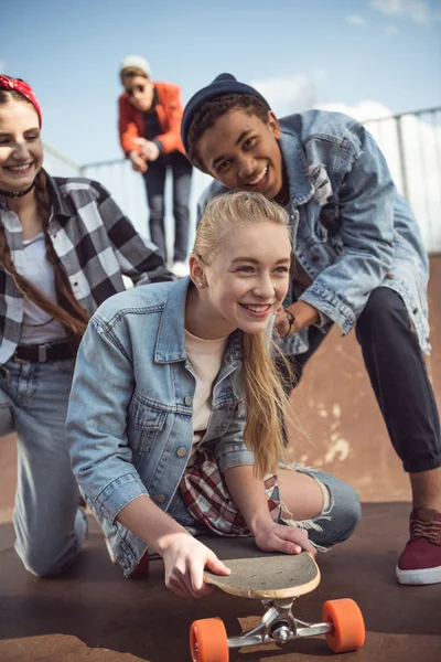 Hipster girl riding skateboard — Stock Photo, Image