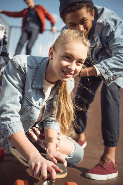 Hipster girl riding skateboard — Stock Photo, Image