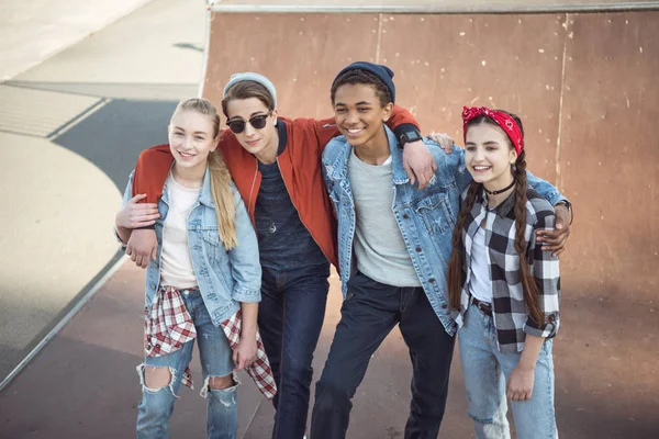 Teenagers spending time at skateboard park — Stock Photo, Image