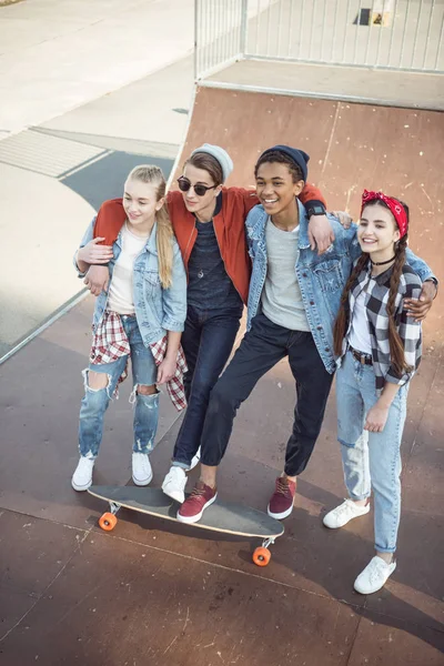 Teenagers spending time at skateboard park — Stock Photo, Image