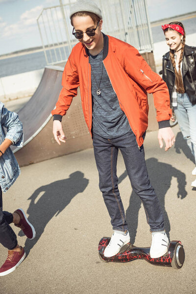 hipster boy riding gyroboard