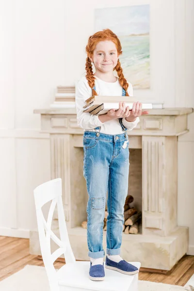 Little girl with books — Stock Photo, Image