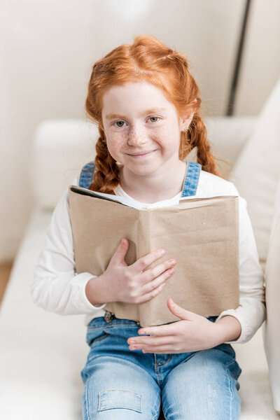 Little girl reading book 