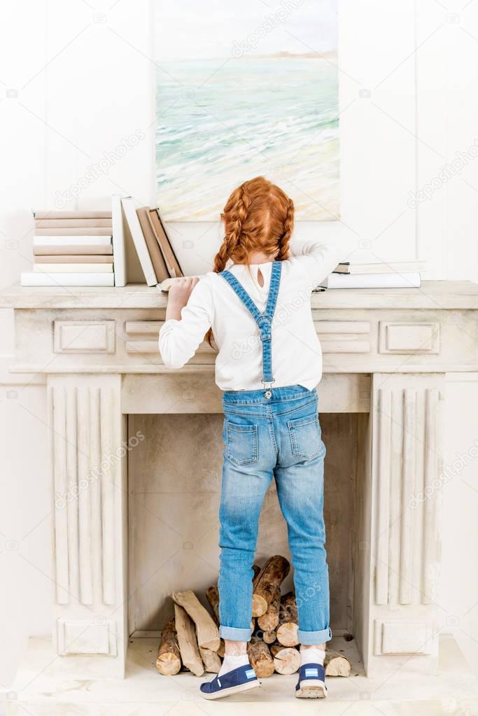Little girl with books 