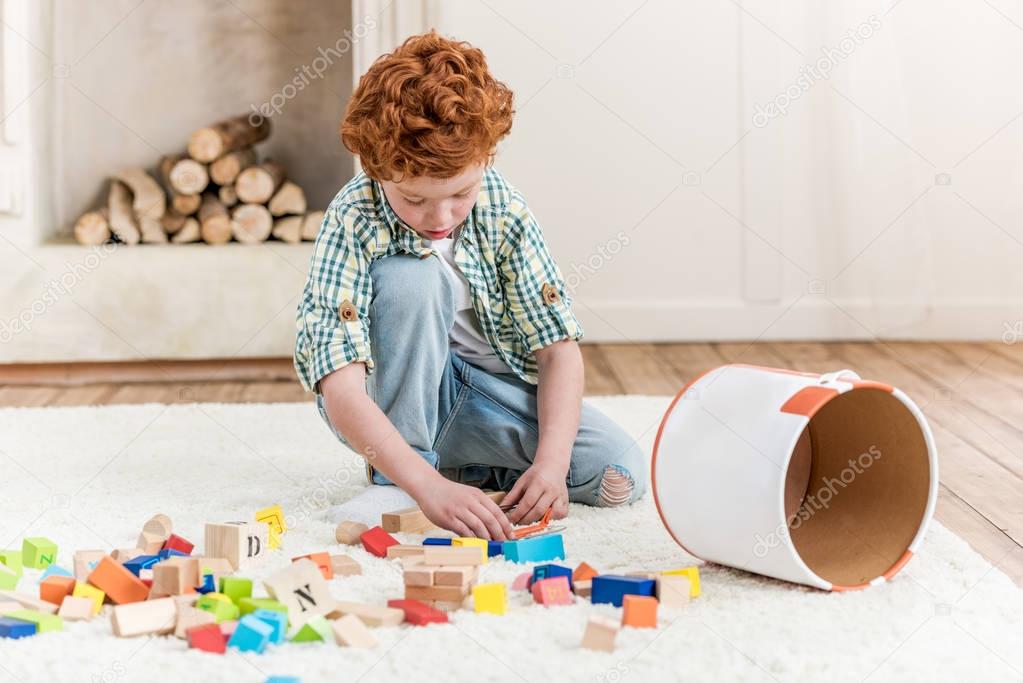 little boy playing with toys