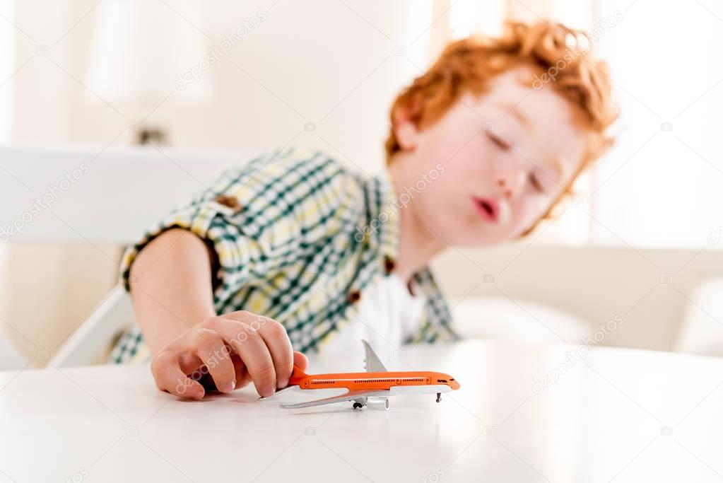 little boy playing with toy