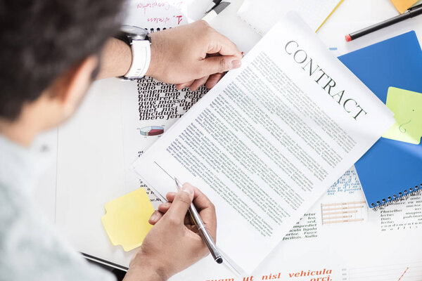 Businessman holding contract 