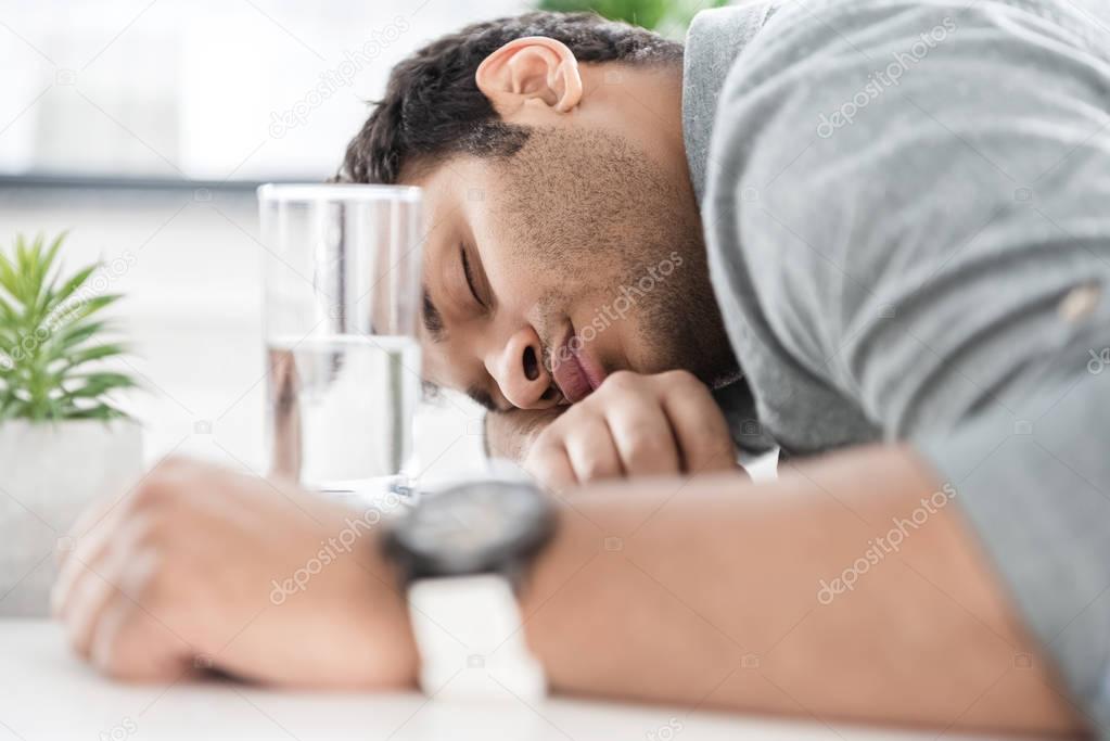 Businessman sleeping on table