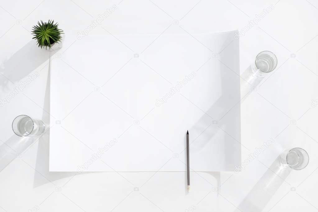 empty banner with pencil and glasses of water