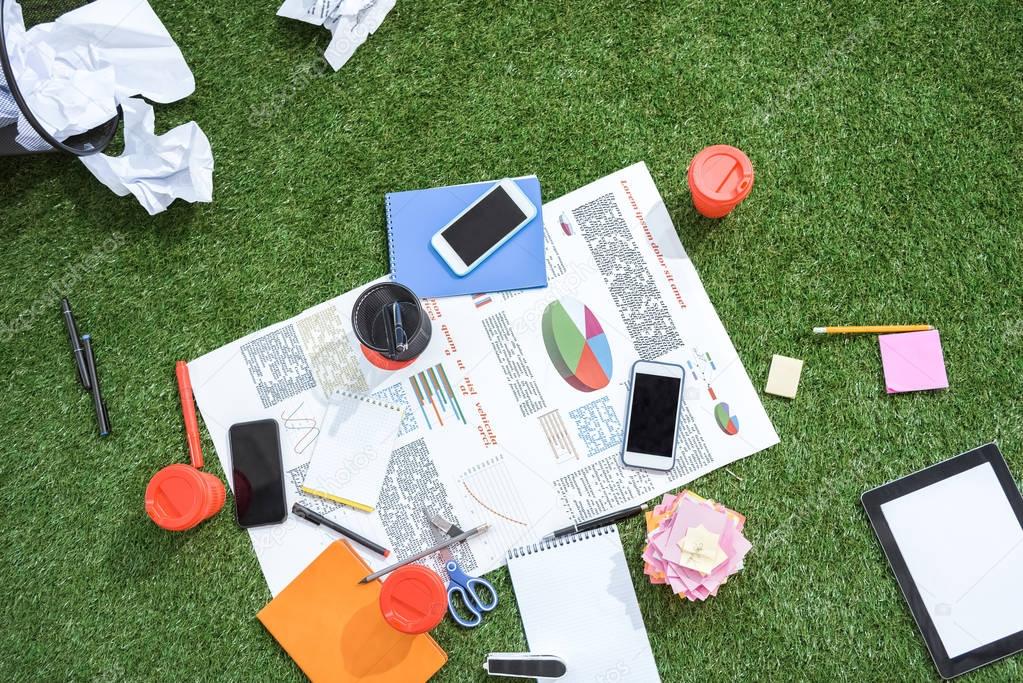 business objects laying on green carpet