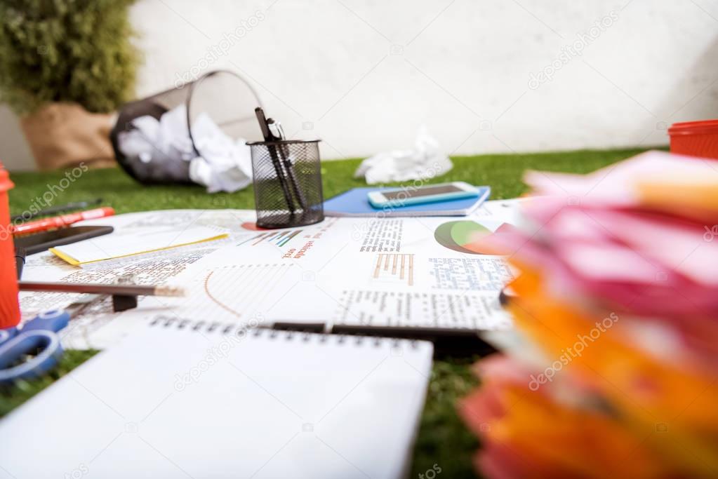 business objects laying on green carpet