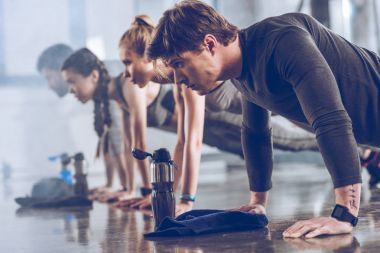 sporty people exercising in gym   clipart