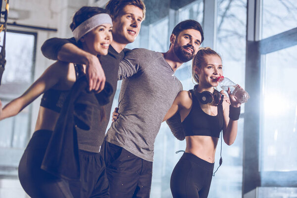 group of sportive people in gym