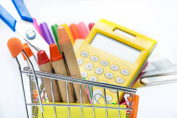 School supplies in shopping cart — Stock Photo, Image