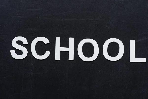 Paper letters school on chalkboard — Stock Photo, Image