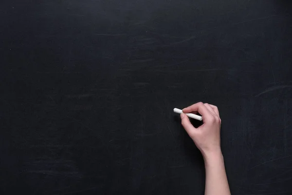 Human hand writing on chalkboard — Stock Photo, Image