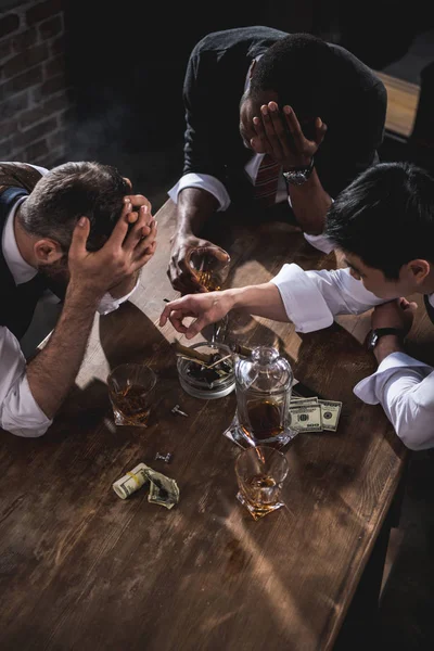 Colleagues drinking alcohol while spending time together after work — Stock Photo, Image