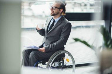 businessman sitting in wheelchair