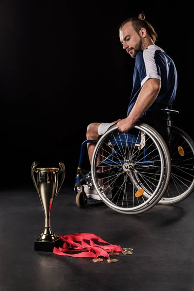Paralympic in wheelchair with trophies — Stock Photo, Image