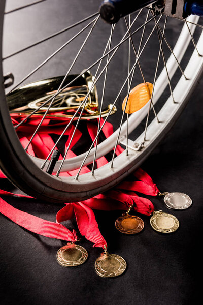 wheelchair standing on trophies