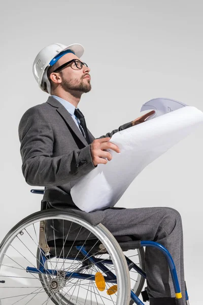 Disabled architect with blueprint — Free Stock Photo