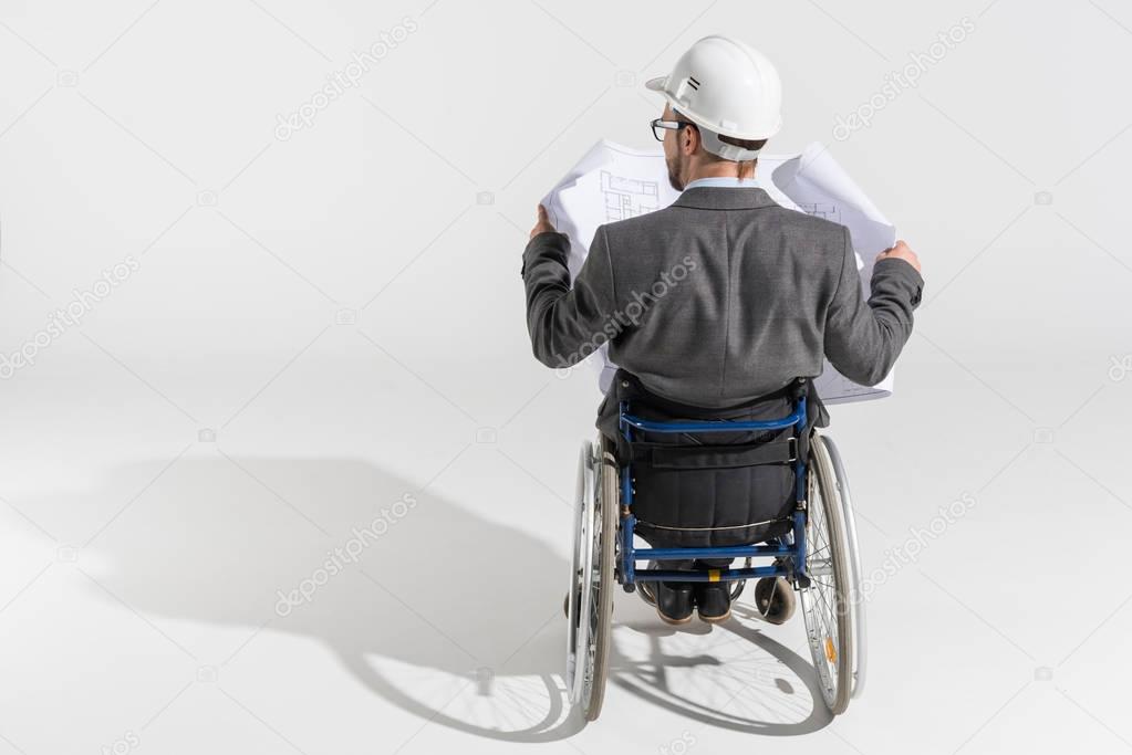 disabled architect with blueprint