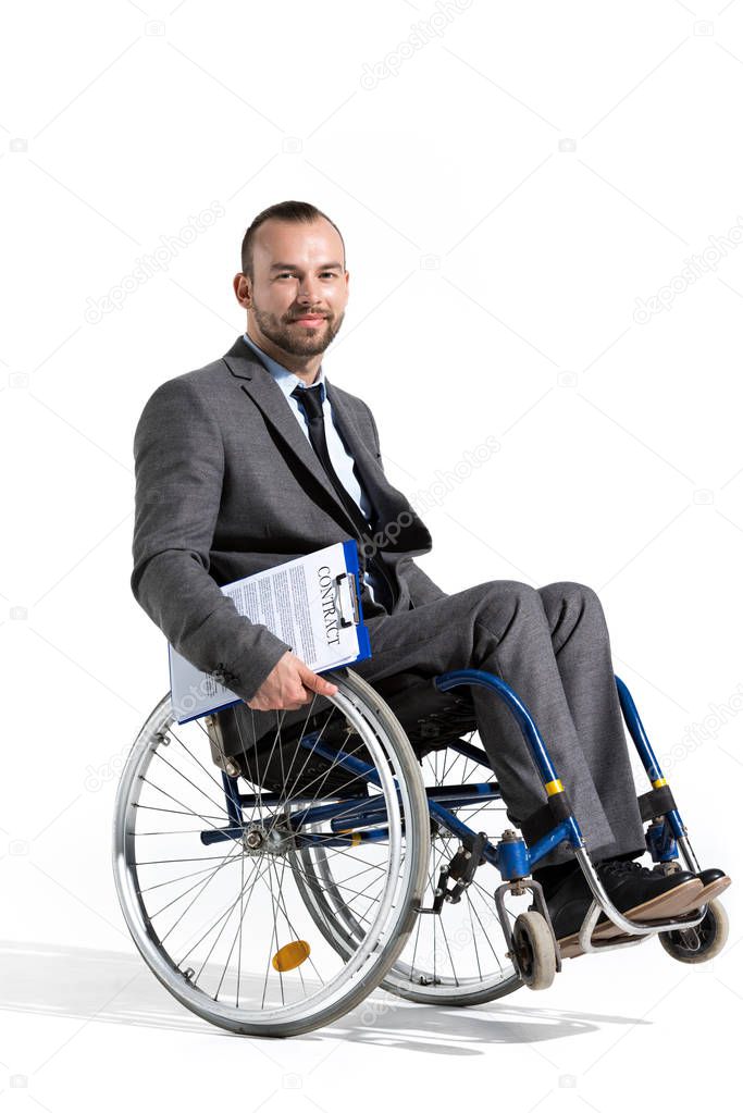 businessman in wheelchair holding clipboard with contract