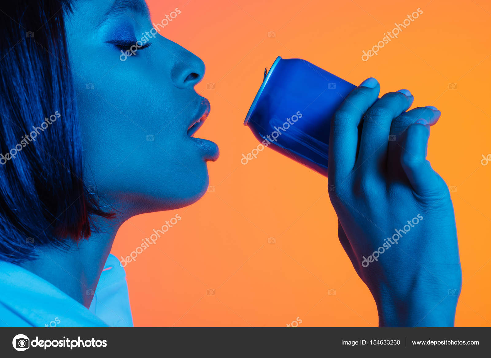 African american girl drinking from can — Stock Photo