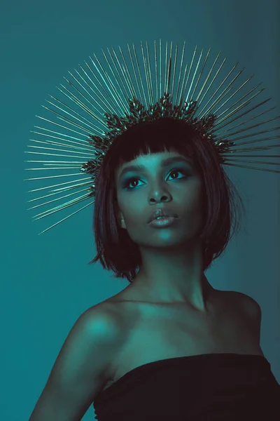 Woman looking away in headpiece with needles — Stock Photo, Image