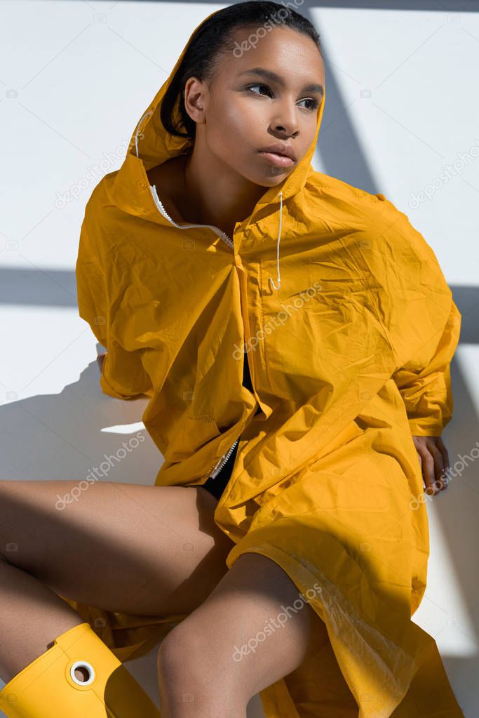 Gorgeous young woman in raincoat 