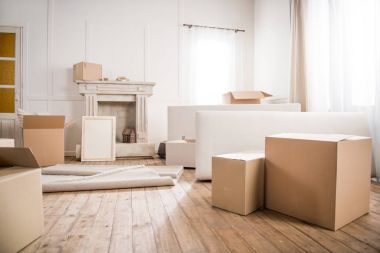 Cardboard boxes in empty room  clipart