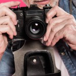 Man with retro photo camera