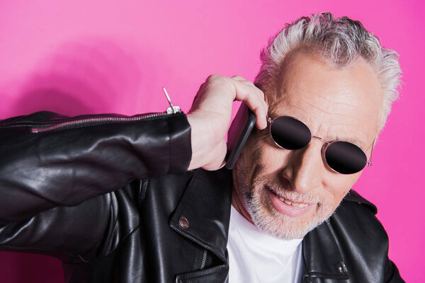 Senior man talking on smartphone 