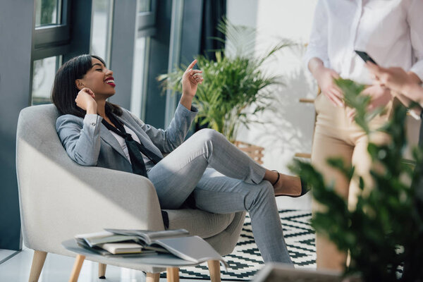 Businesswoman resting in chair 